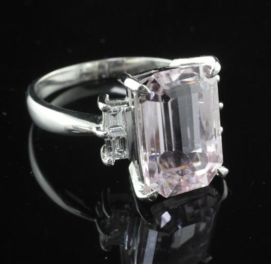 A 900 platinum, emerald cut kunzite and diamond set dress ring, size O.